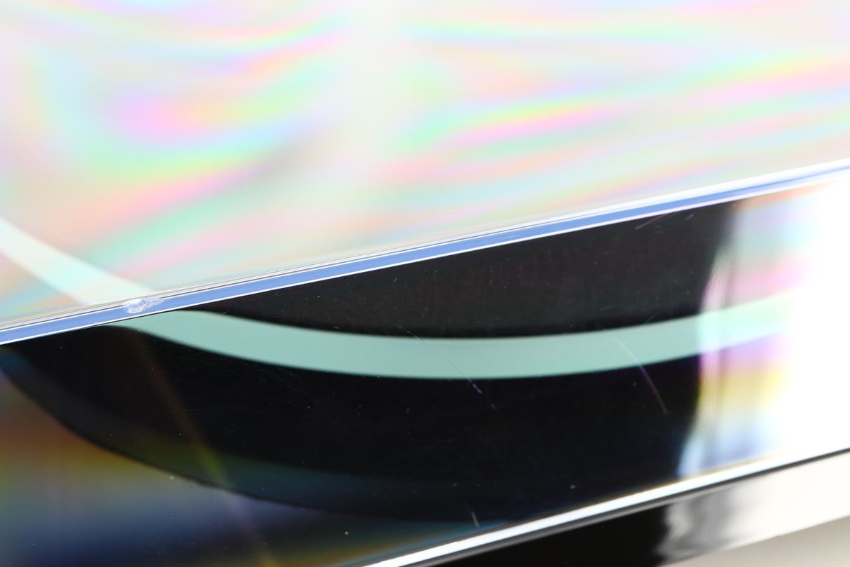 Close up of a used Rega Planar 2 / Elys 2 Cartridge in a black gloss finish showing some scratches and chip on lid