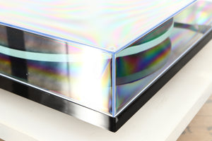 Front left corner of a used Rega Planar 2 / Elys 2 Cartridge in a black gloss finish