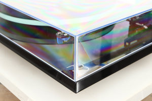 Front right corner of a used Rega Planar 2 / Elys 2 Cartridge in a black gloss finish
