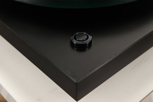 Close up of a used Rega Planar 3 (24V Motor Upgraded) Turntable / Grado F3+ Cartridge in a black finish showing scratching on plinth