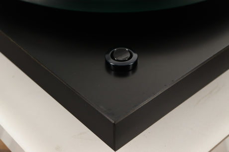 Close up of a used Rega Planar 3 (24V Motor Upgraded) Turntable / Grado F3+ Cartridge in a black finish showing scratching on plinth