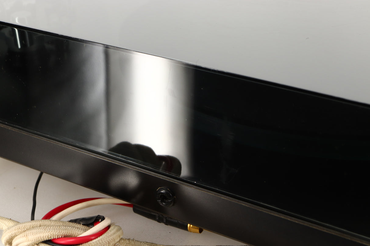 Close up of a used Rega Planar 3 (24V Motor Upgraded) Turntable / Grado F3+ Cartridge in a black finish showing scratching on lid