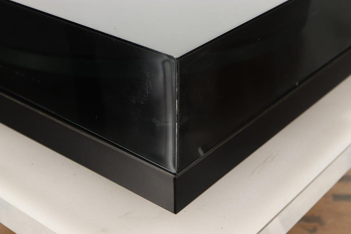 Front left corner of a used Rega Planar 3 (24V Motor Upgraded) Turntable / Grado F3+ Cartridge in a black finish