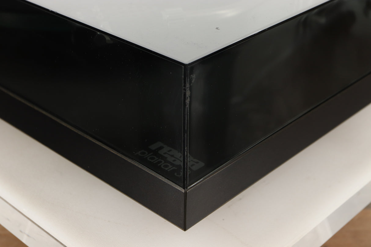 Front right corner of a used Rega Planar 3 (24V Motor Upgraded) Turntable / Grado F3+ Cartridge in a black finish
