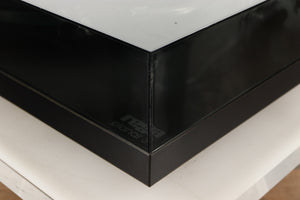 Front right corner of a used Rega Planar 3 (24V Motor Upgraded) Turntable / Grado F3+ Cartridge in a black finish