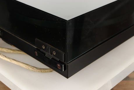 Rear left corner of a used Rega Planar 3 (24V Motor Upgraded) Turntable / Grado F3+ Cartridge in a black finish