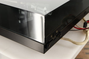 Rear right corner of a used Rega Planar 3 (24V Motor Upgraded) Turntable / Grado F3+ Cartridge in a black finish