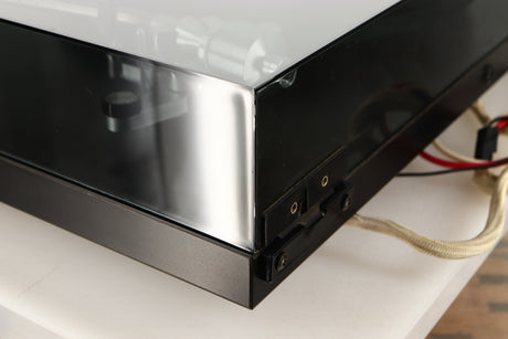 Rear right corner of a used Rega Planar 3 (24V Motor Upgraded) Turntable / Grado F3+ Cartridge in a black finish