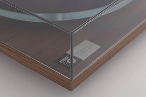 Front left corner of a used Rega Planar 3 50th Anniversary Turntable in a Walnut finish