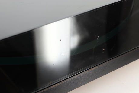 Close up of a used Rega Planar 3 (24V Upgraded) Turntable / Goldring E3 Cartridge in a black finish showing some scratching on left side of lid