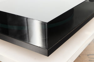 Front left corner of a used Rega Planar 3 (24V Upgraded) Turntable / Goldring E3 Cartridge in a black finish