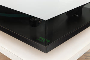 Front right corner of a used Rega Planar 3 (24V Upgraded) Turntable / Goldring E3 Cartridge in a black finish