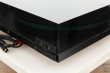 Rear left corner of a used Rega Planar 3 (24V Upgraded) Turntable / Goldring E3 Cartridge in a black finish