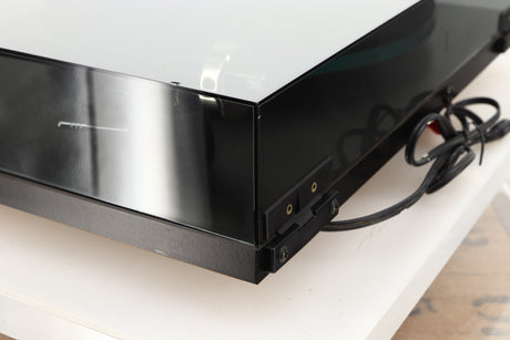 Rear right corner of a used Rega Planar 3 (24V Upgraded) Turntable / Goldring E3 Cartridge in a black finish