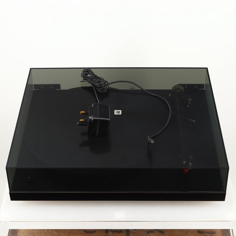 Top of a used Rega Planar 3 Turntable 24V Upgraded in a black finish showing Power Supply
