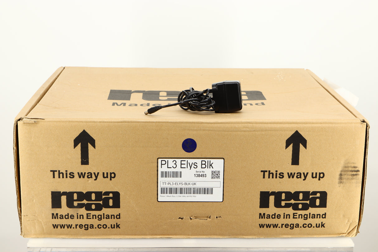 Box for a used Rega Planar 3 Turntable / Elys Cartridge in a black finish showing PSU