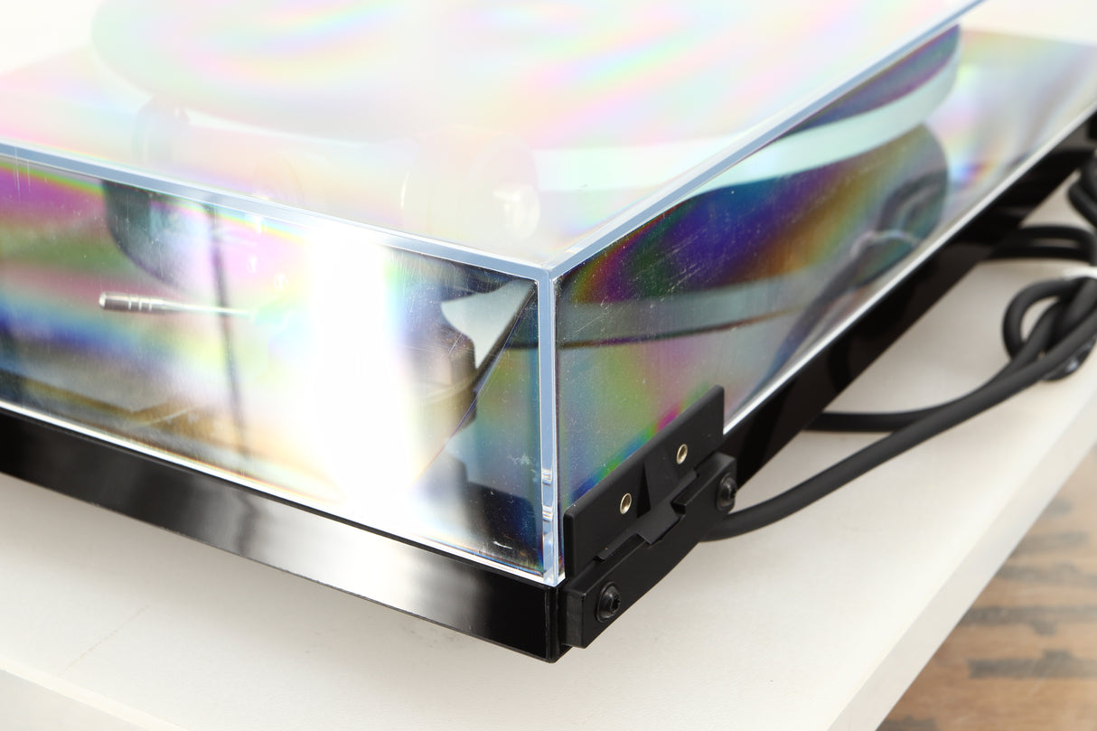 Rear right corner of a used Rega Planar 3 Turntable / Elys Cartridge in a black finish