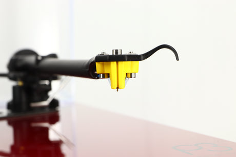 Close up view of a used Rega Planar 3 Turntable in Red finish with Exact Cartridge