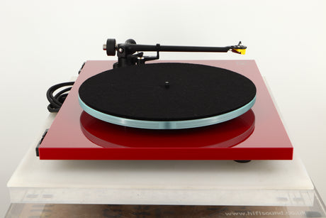 Side view of a used Rega Planar 3 Turntable in Red finish with Exact Cartridge