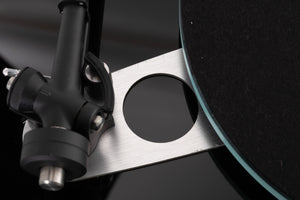 Close up view of a used Rega Planar 3 Turntable in Gloss Black with Elys Cartridge