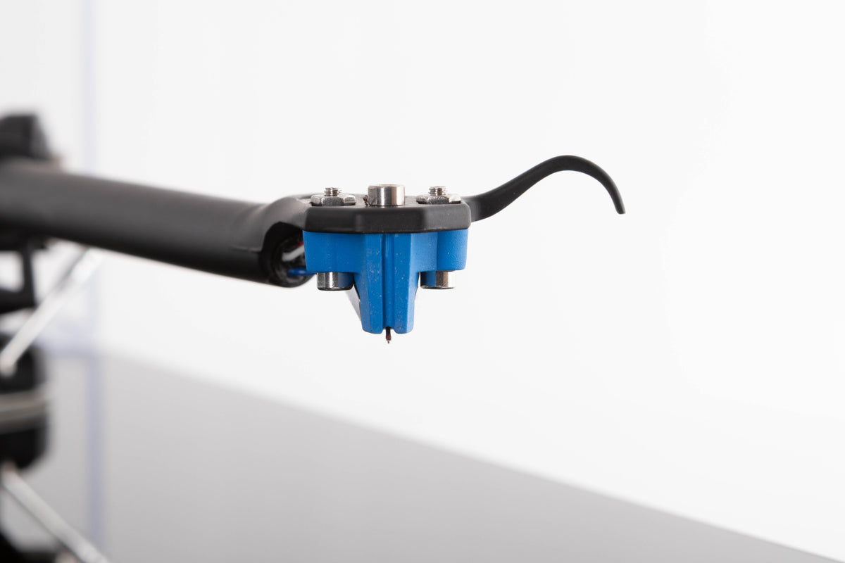 Close up view of a used Rega Planar 3 Turntable in Gloss Black with Elys Cartridge