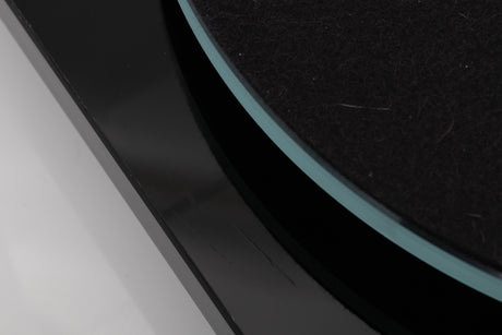 Close up view of a used Rega Planar 3 Turntable in Gloss Black with Elys Cartridge