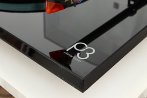 Close up of a used Rega Planar 3 Turntable / Ortofon 2M Bronze Cartridge / NEO Power Supply in a black finish showing some scratches