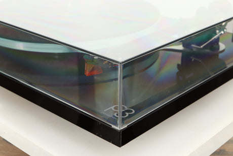Front right corner of a used Rega Planar 3 Turntable / Ortofon 2M Bronze Cartridge / NEO Power Supply in a black finish
