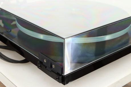 Rear left corner of a used Rega Planar 3 Turntable / Ortofon 2M Bronze Cartridge / NEO Power Supply in a black finish