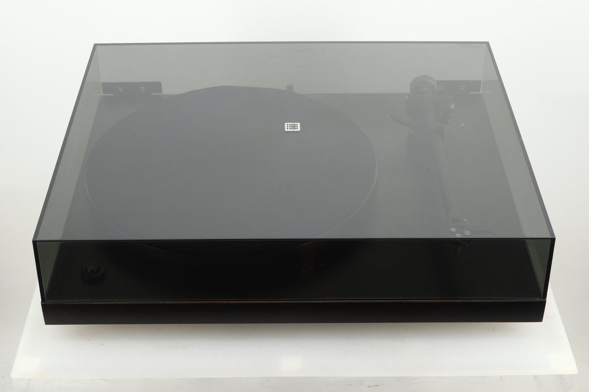 Top view of a used Rega Planar 3 Turntable with lid