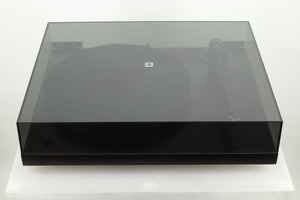Top view of a used Rega Planar 3 Turntable with lid