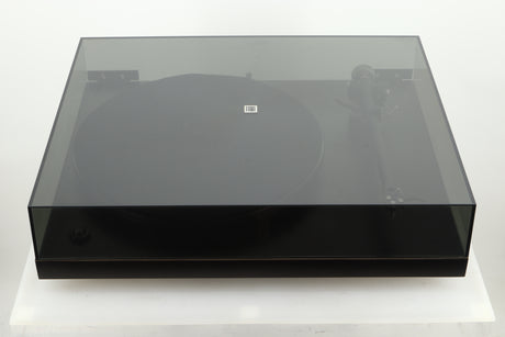 Top view of a used Rega Planar 3 Turntable with lid