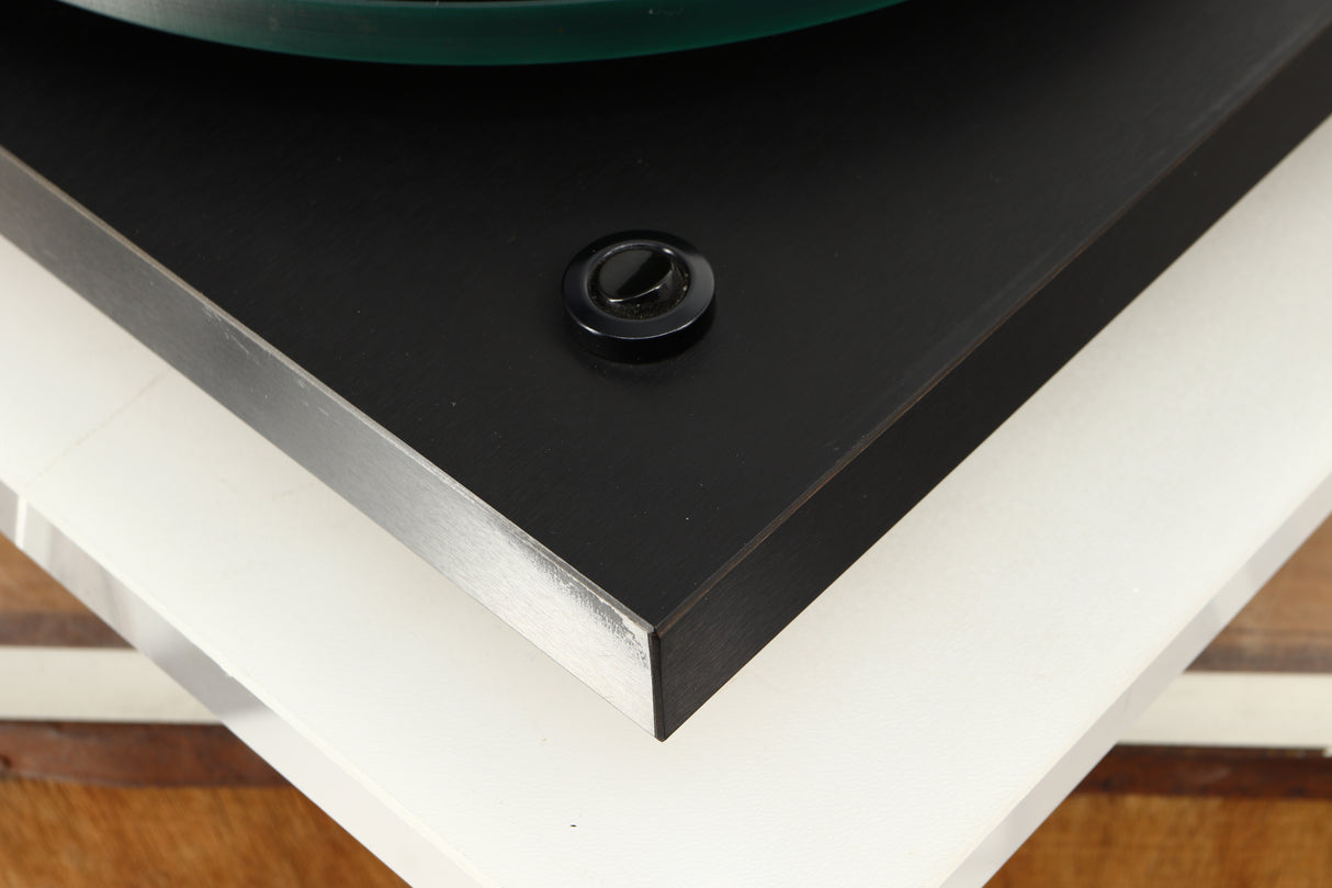 Close up of a used Rega Planar 3 Turntable W/ Goldring 1006 Cartridge in a black finish showing blemishes
