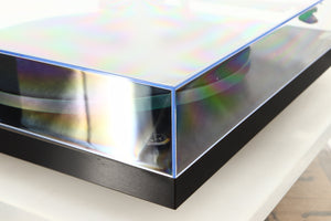 Front left corner of a used Rega Planar 3 Turntable W/ Goldring 1006 Cartridge in a black finish