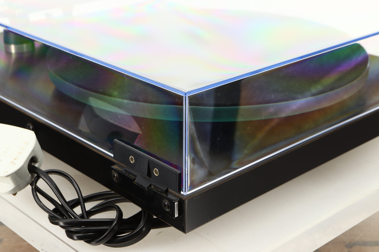 Rear left corner of a used Rega Planar 3 Turntable W/ Goldring 1006 Cartridge in a black finish