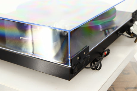 Rear right corner of a used Rega Planar 3 Turntable W/ Goldring 1006 Cartridge in a black finish