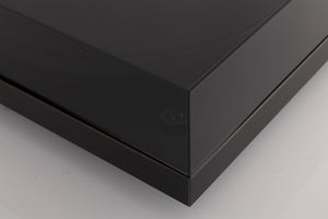 Front left corner of a used Rega Planar 3 Turntable W/ Nagaoka MP11 Boron Cartridge in a Black finish