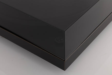 Front left corner of a used Rega Planar 3 Turntable W/ Nagaoka MP11 Boron Cartridge in a Black finish