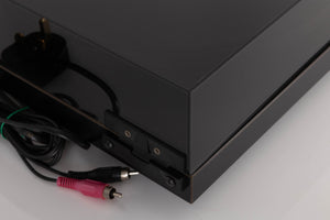 Rear left corner of a used Rega Planar 3 Turntable W/ Nagaoka MP11 Boron Cartridge in a Black finish