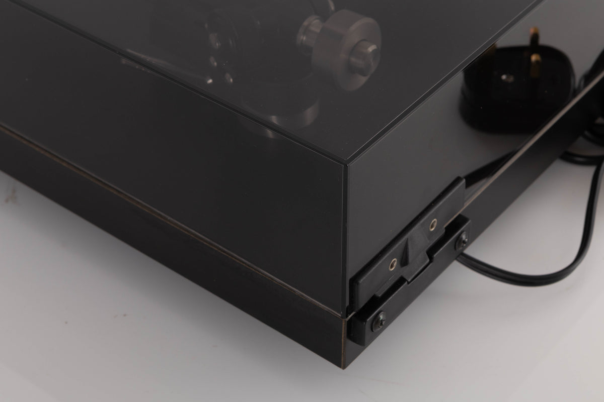 Rear right corner of a used Rega Planar 3 Turntable W/ Nagaoka MP11 Boron Cartridge in a Black finish