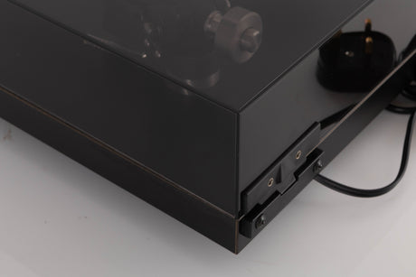 Rear right corner of a used Rega Planar 3 Turntable W/ Nagaoka MP11 Boron Cartridge in a Black finish