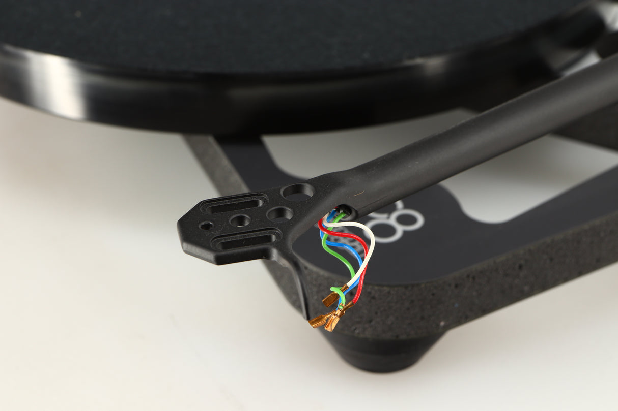 Close up of a used Rega Planar 8 Turntable (No Cartridge) in a black finish showing connectors