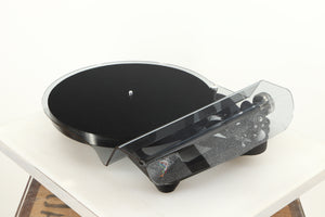 Front right angle of a used Rega Planar 8 Turntable (No Cartridge) in a black finish showing Lid