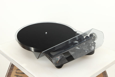 Front right angle of a used Rega Planar 8 Turntable (No Cartridge) in a black finish showing Lid