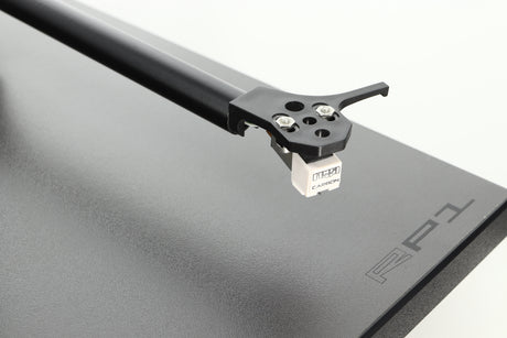 Close up of a used Rega Planar RP1 Turntable in a cool grey finish showing the cartridge