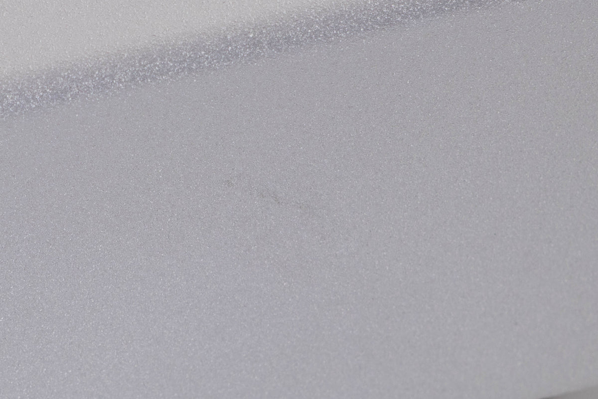 Close up of a used Rega Planet CD Player in a Silver finish showing light mark on right side
