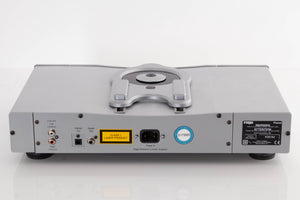 Rear view of a used Rega Planet CD Player in a Silver finish showing Mains Input, Digital Output, Optical Output and Phono Outputs