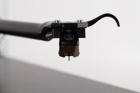Close up view of a used Rega RP3 Turntable in Cool Grey with AT-VM95SH Cartridge