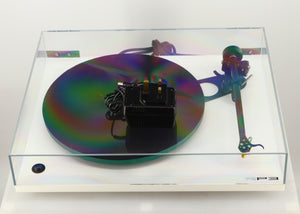 Top view of a used Rega RP3 / Exact Cartridge in a white finish showing PSU