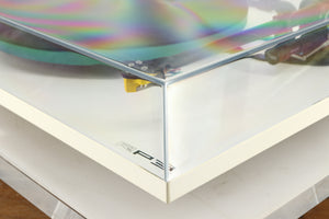 Front right corner of a used Rega RP3 / Exact Cartridge in a white finish